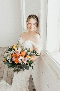 bride with bouquet photo by Madisen Watson